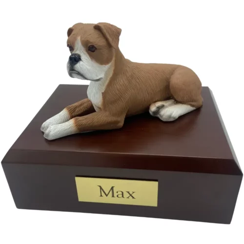 Laying ears down boxer dog figurine on wood memorial pet cremation urn