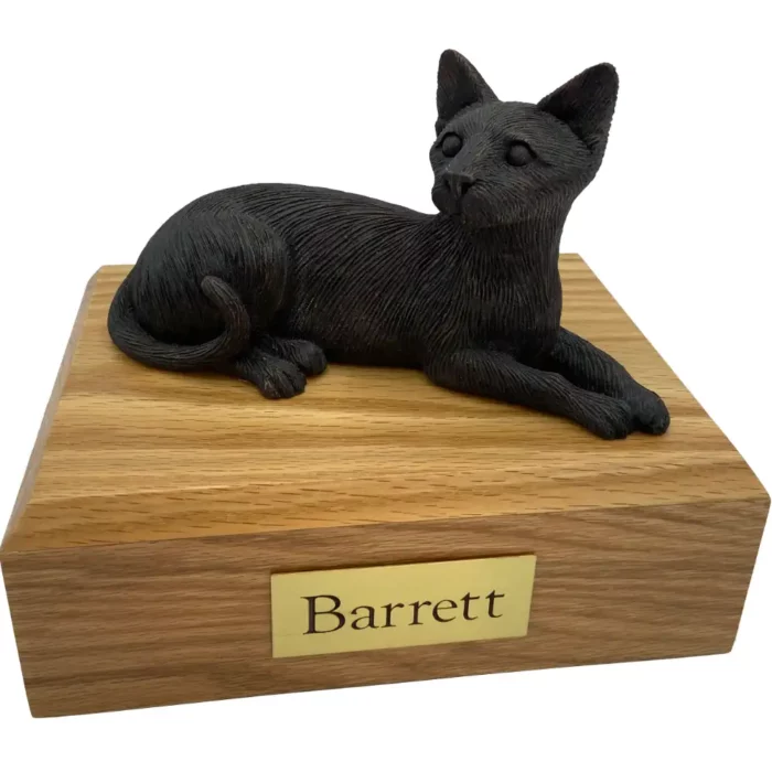 Laying bronze look Siamese cat figurine on wood memorial pet cremation urn