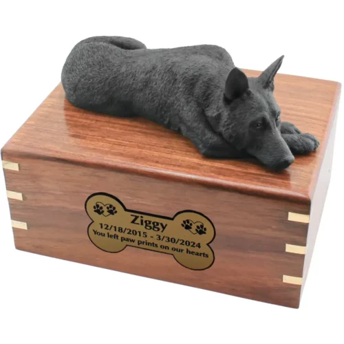 Black german shepherd figurine on wood cremation urn, with engraved plate