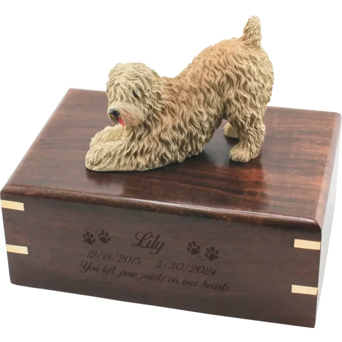 Soft coated wheaten dog figurine on wood cremation urn, engraved wood